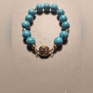 Freida Rothman Turquoise Beaded Bracelet with Gold Flower Accent 6" Stretchy